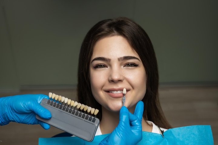 patient choosing a shade for her best veneers in orlando
