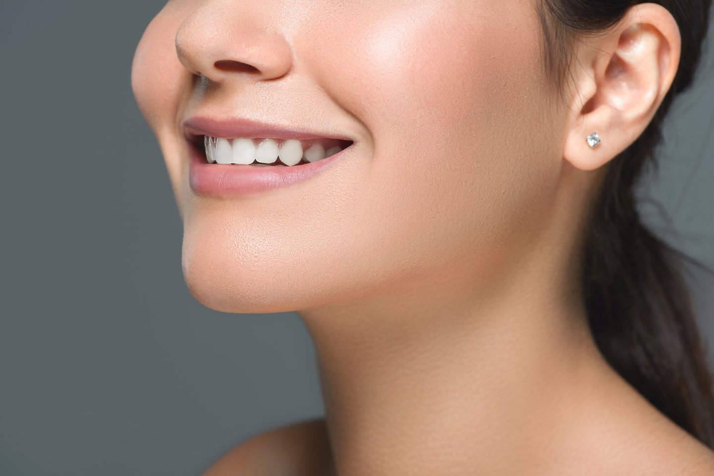 woman showing off her new smile after park dental teeth whitening