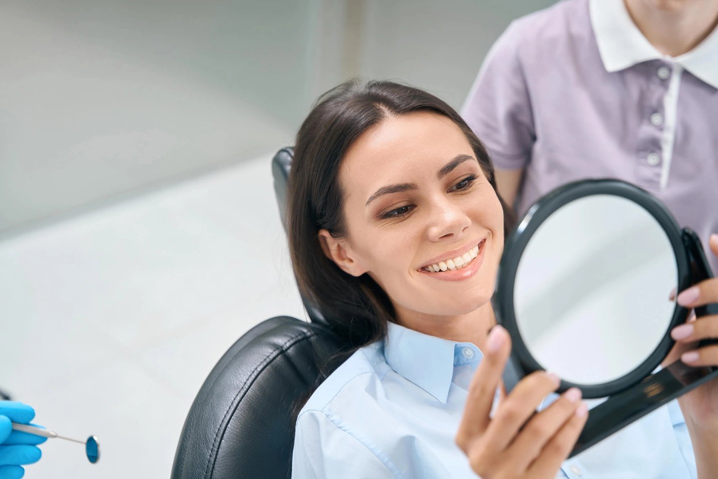 Girl-checking-her-porcelain-veneers-orlando-fl