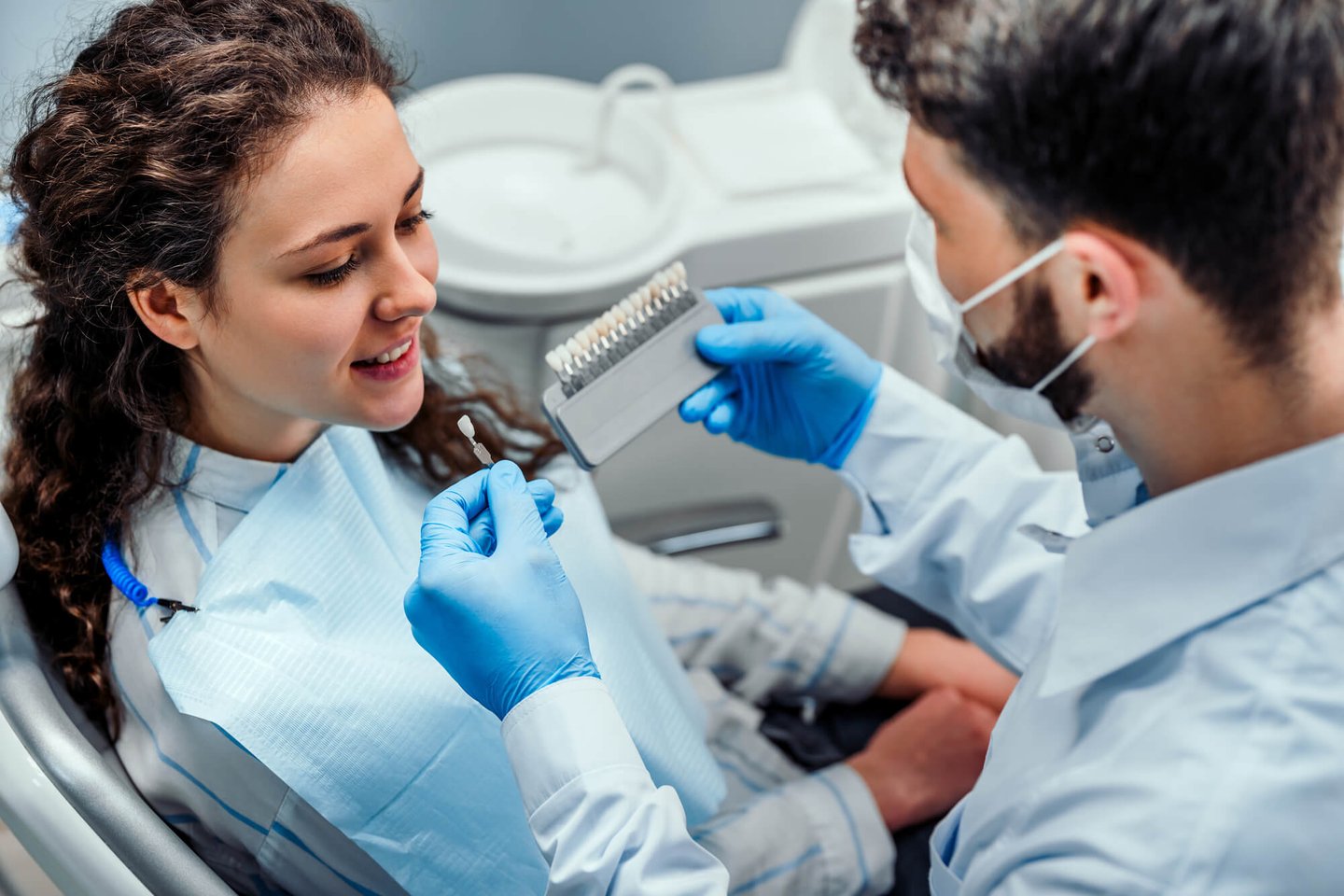 dentist explaining dental crowns orlando fl to patient