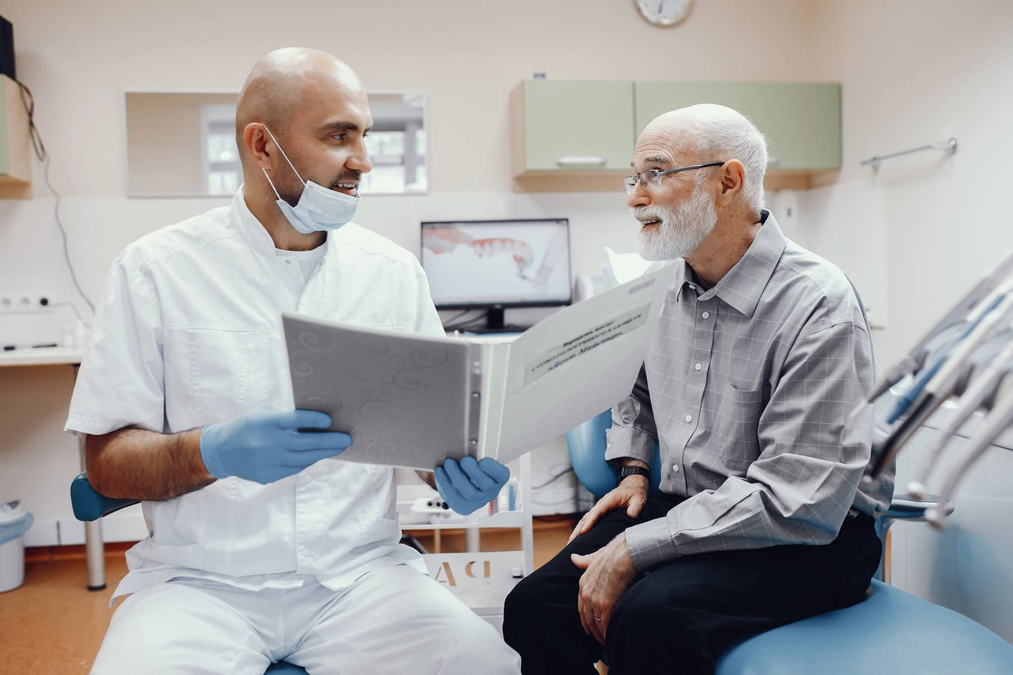 dentist winter park talks to elderly patient