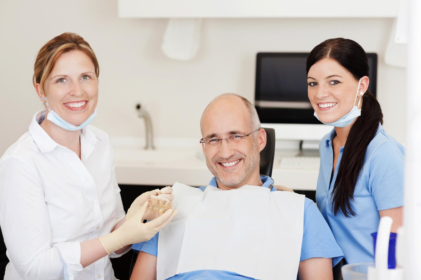 man smiling after getting all-on-4 dental implants Winter Park fl