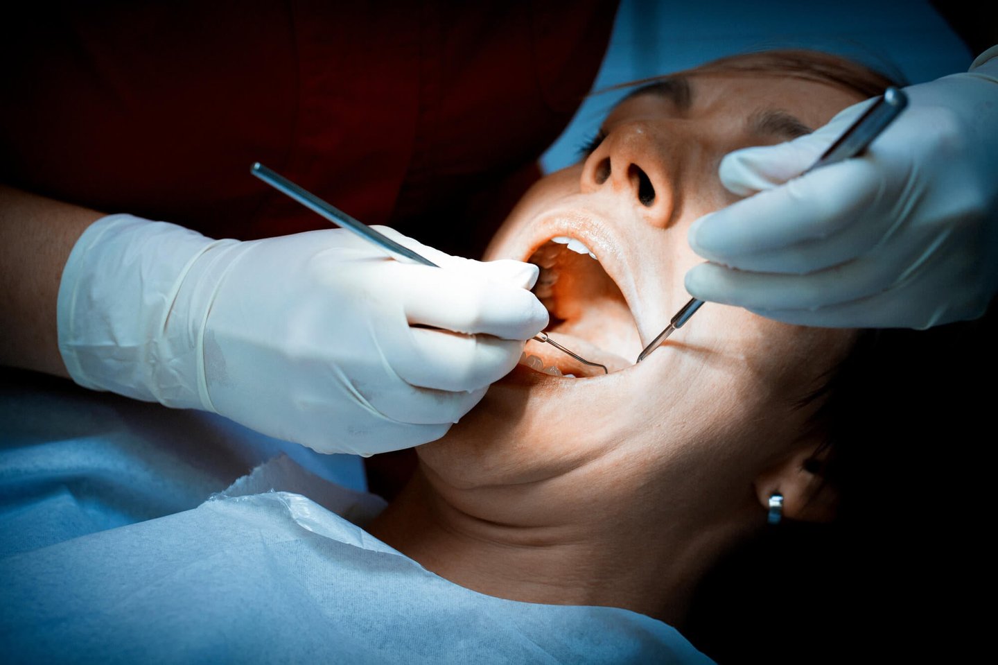 dentist winter park performs dental exam