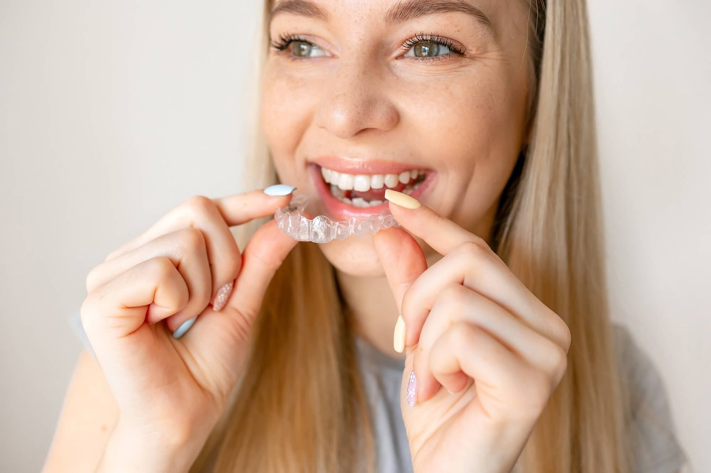 blonde patient about to wear her winter park fl invisalign