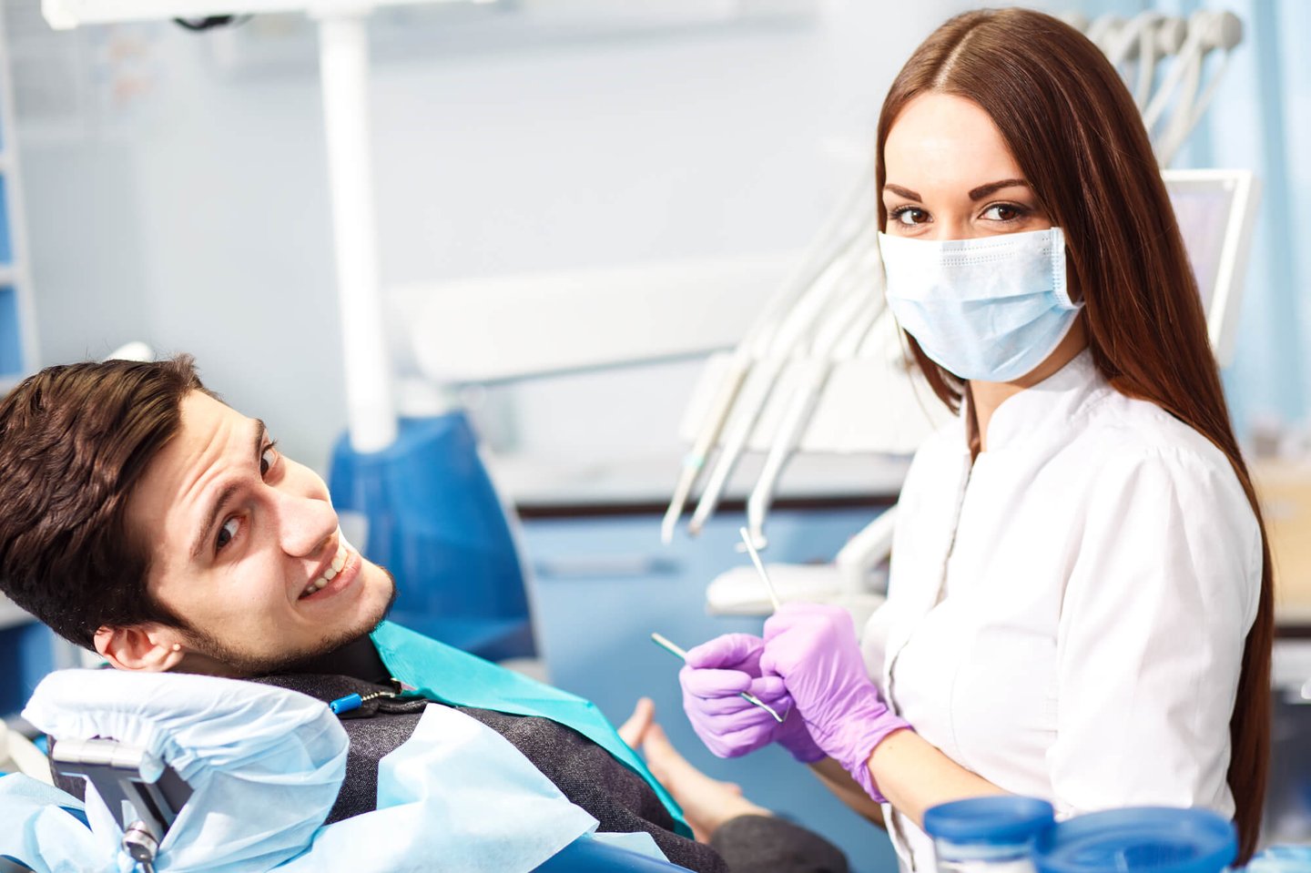 smiling patient after a Full Mouth Restoration