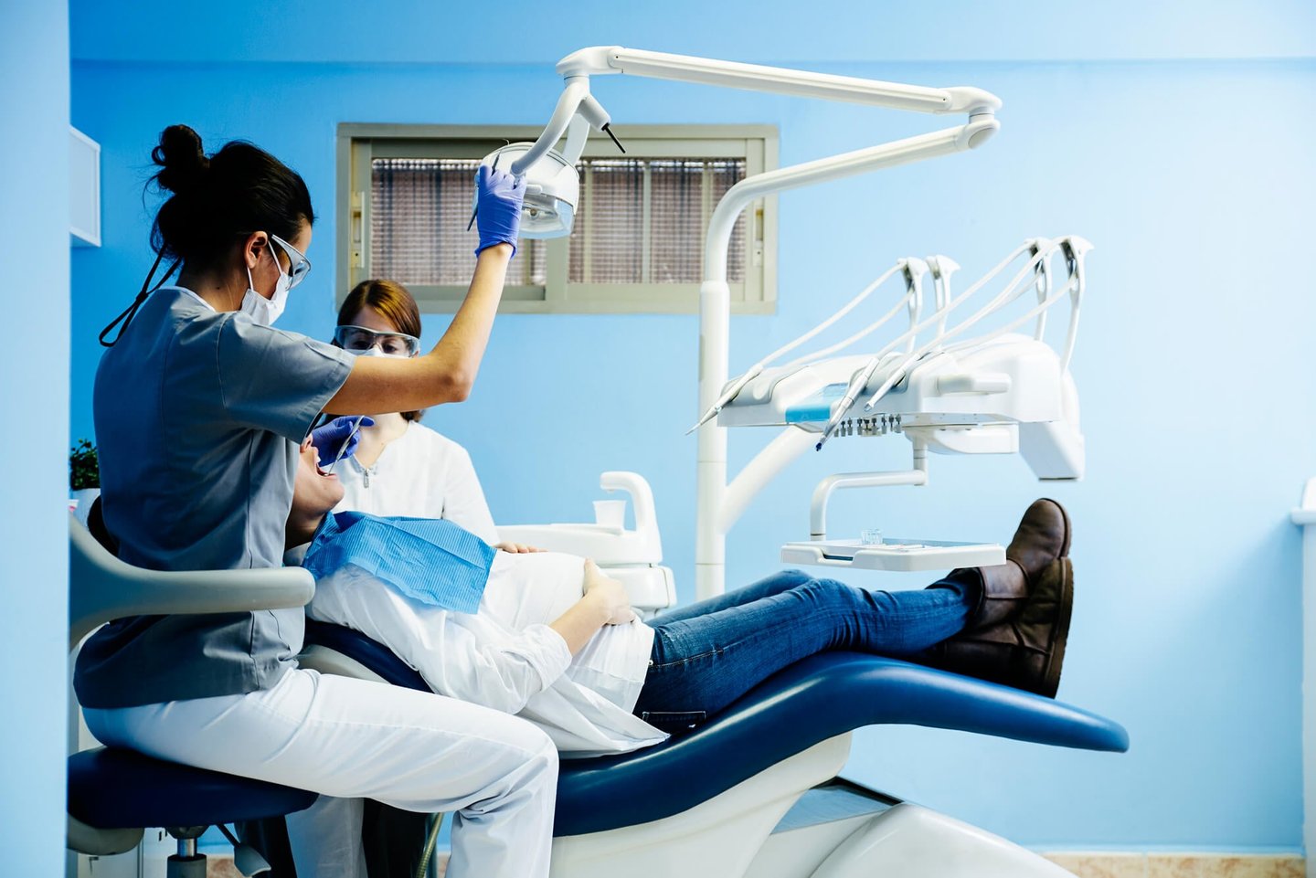dental professionals performing a Full Mouth Restoration