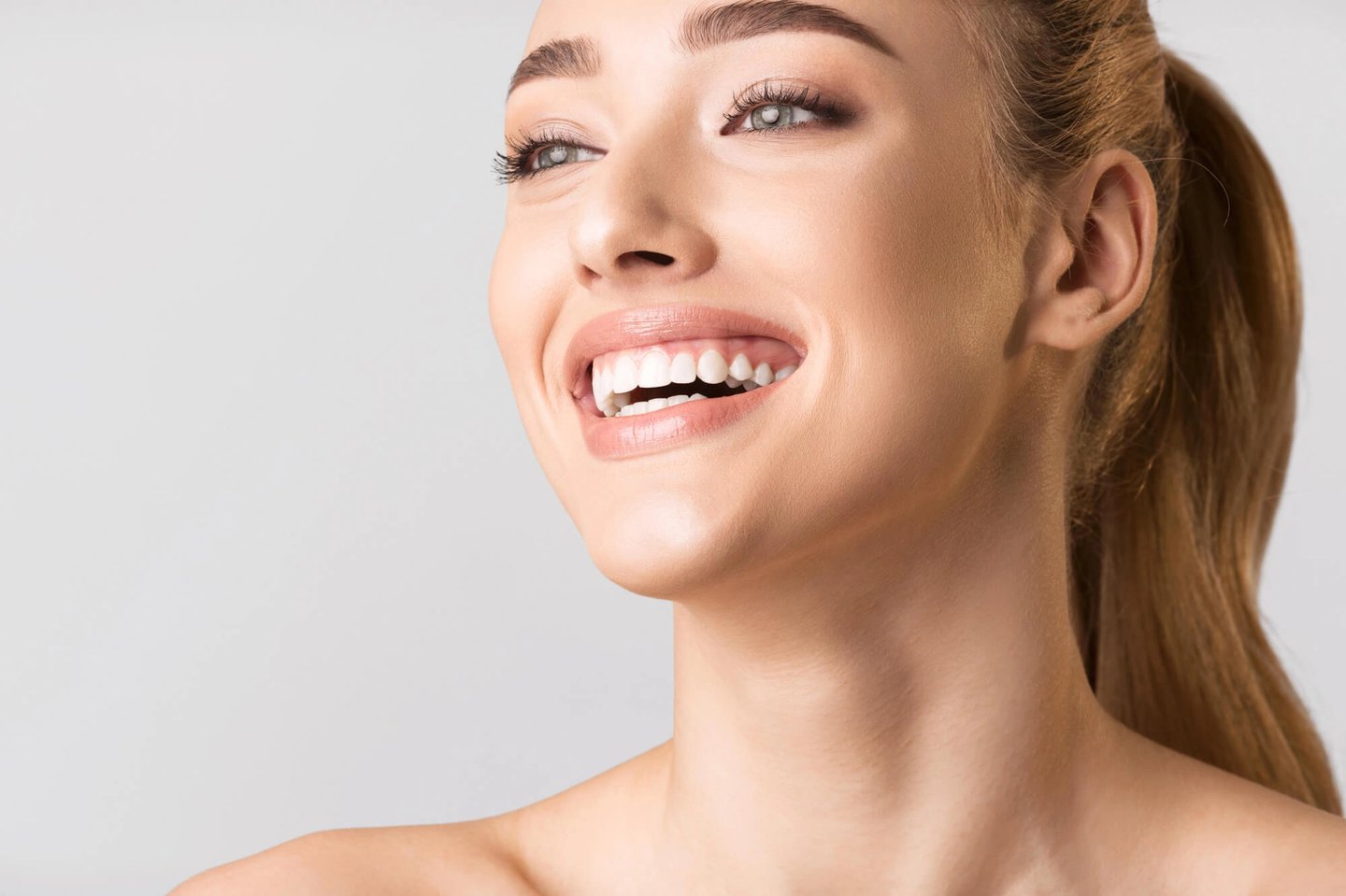 Girl-showing-off-her-porcelain-veneers-orlando-fl
