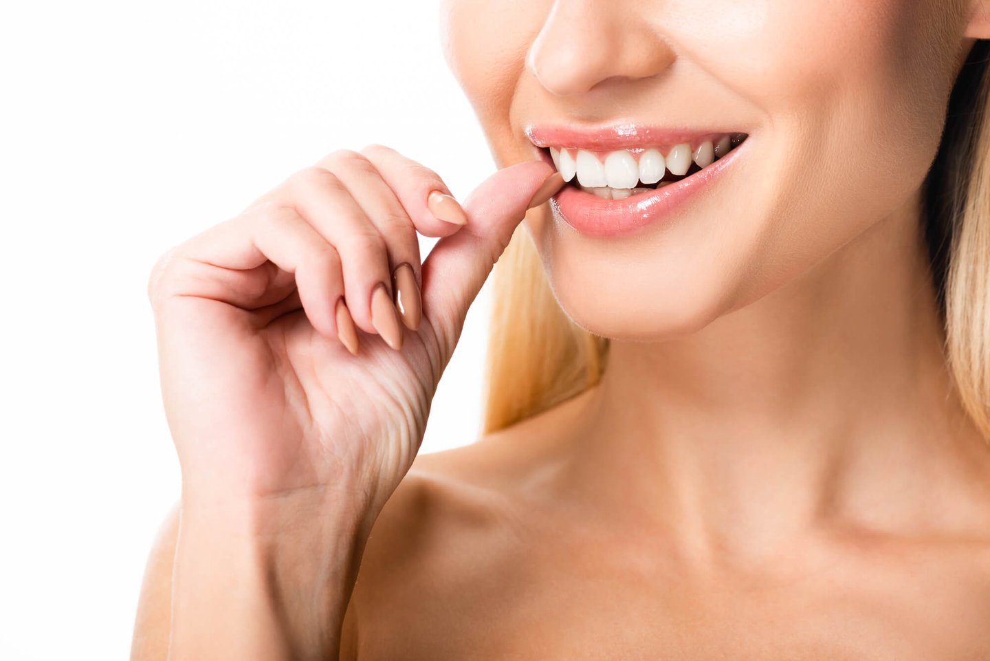 patient checks veneers attached by the best dentist in Orlando, FL