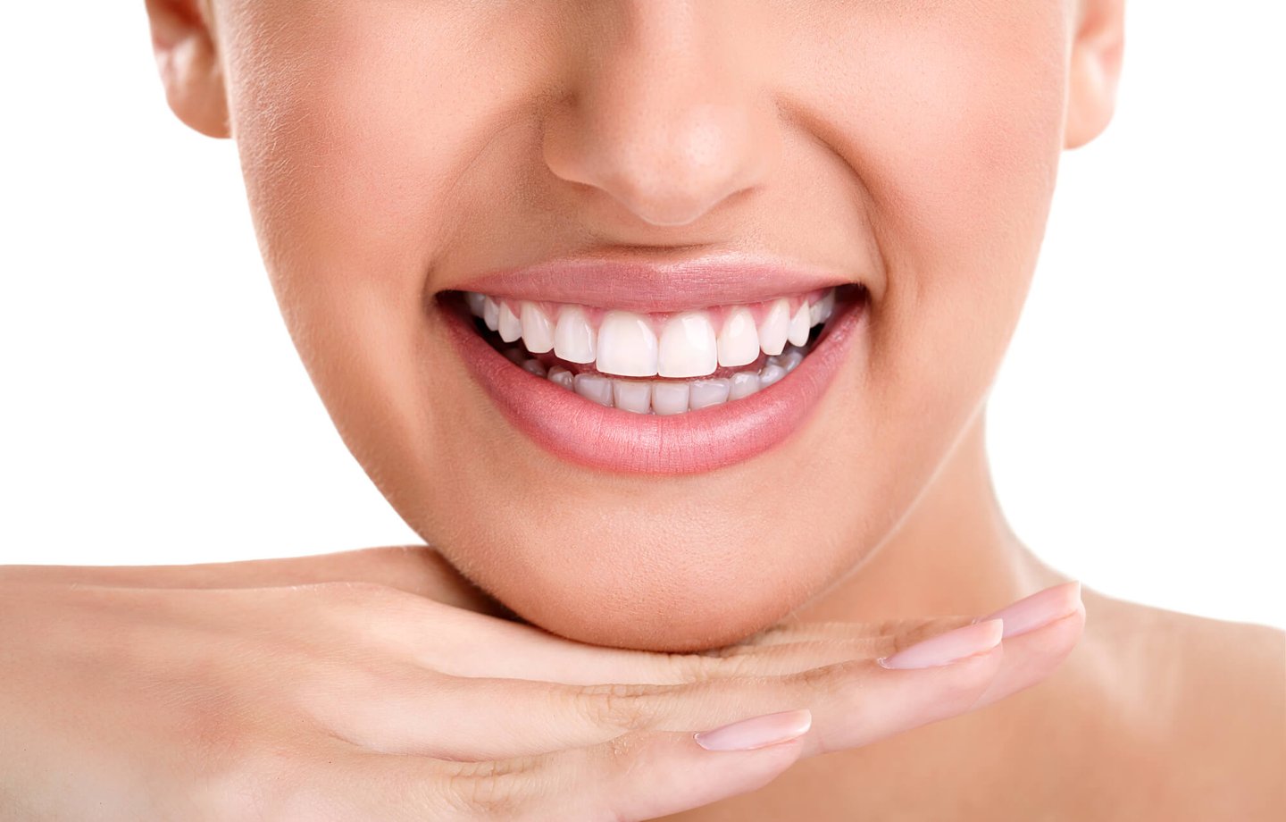woman smiling showing half of her face while wearing natural looking dental implants