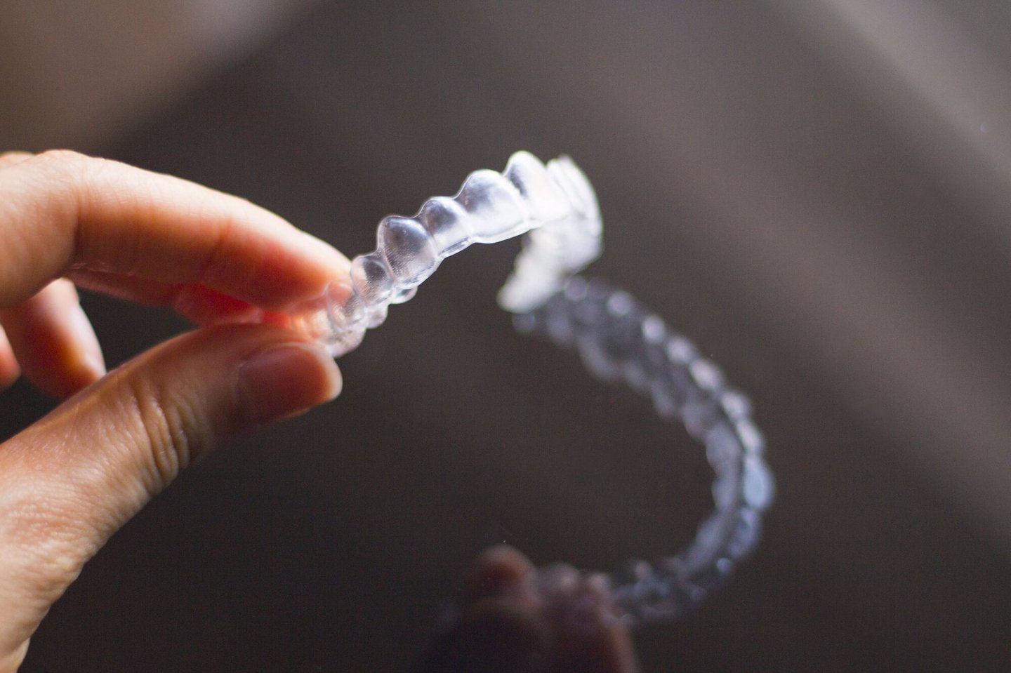 person holds Winter Park, FL Invisalign