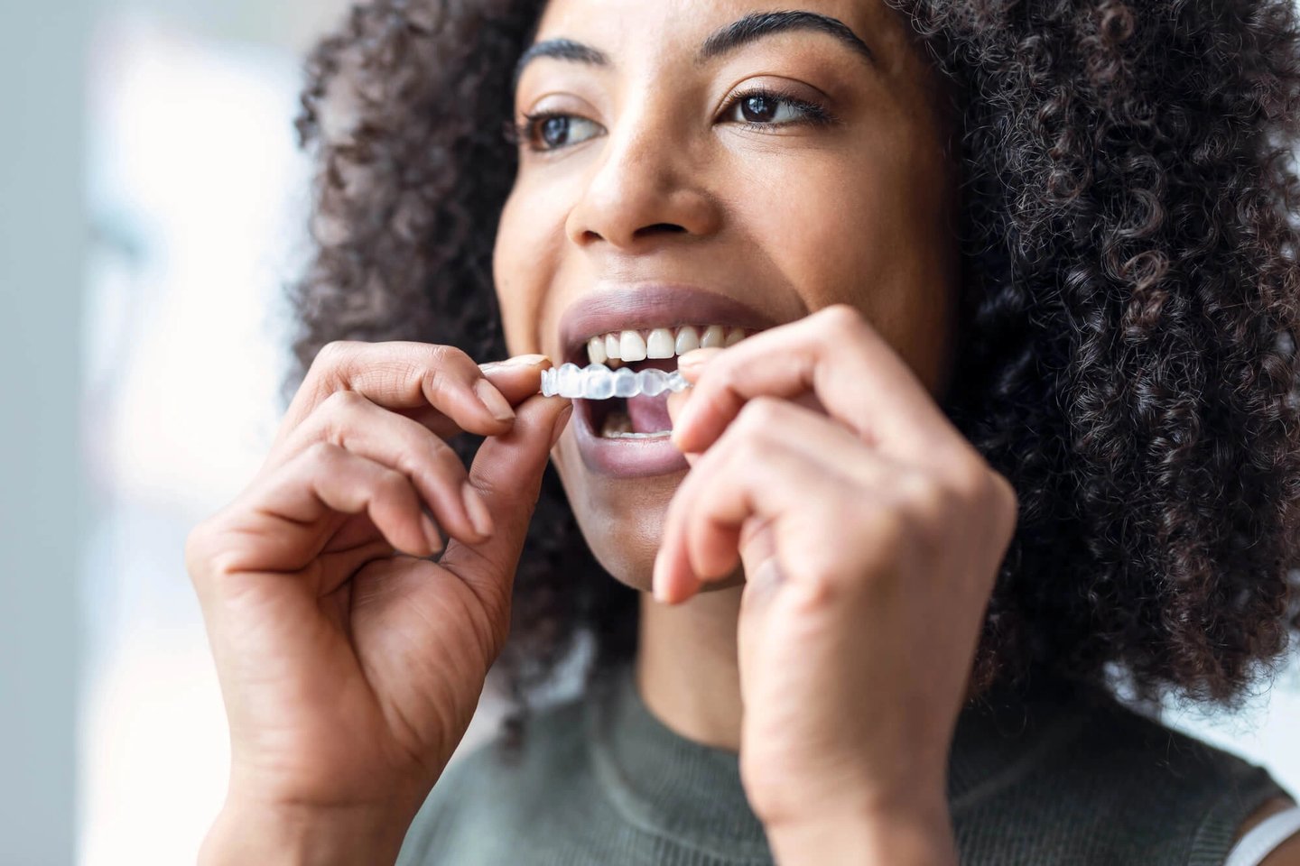 Girl wearing winter park fl invisalign